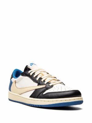 White sneaker with black and blue accents on a white background