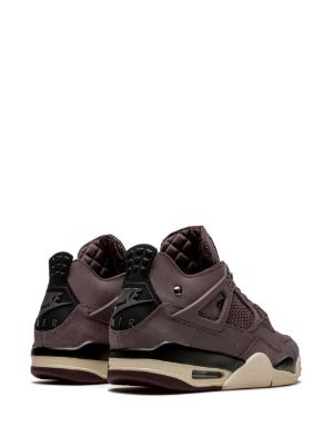 Pair of brown sneakers with black and beige accents on a white background